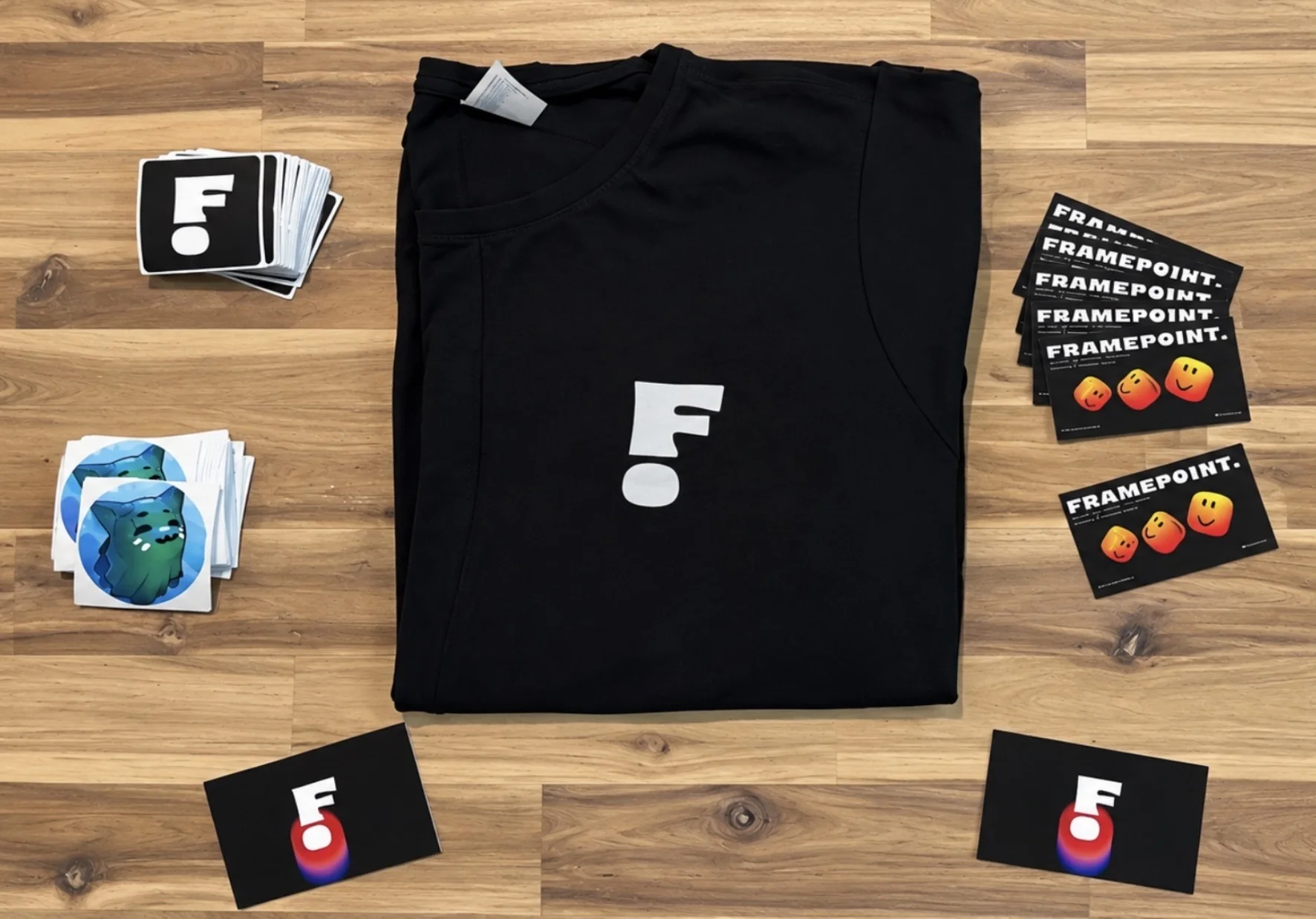 Framepoint team kit with a branded shirt, stickers and cards